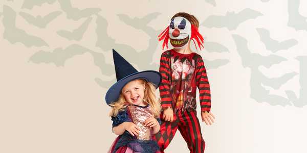 Kids dressed for Halloween in a witch and joker costume. 